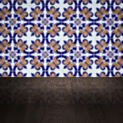 Image showing Wood table top and blur vintage ceramic tile pattern wall