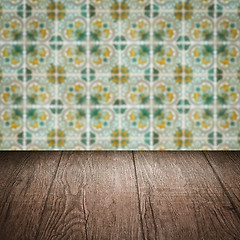 Image showing Wood table top and blur vintage ceramic tile pattern wall