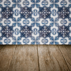 Image showing Wood table top and blur vintage ceramic tile pattern wall