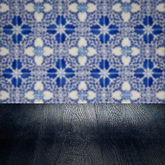 Image showing Wood table top and blur vintage ceramic tile pattern wall