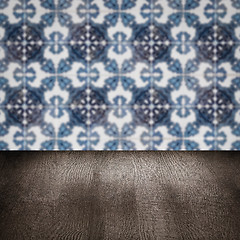 Image showing Wood table top and blur vintage ceramic tile pattern wall