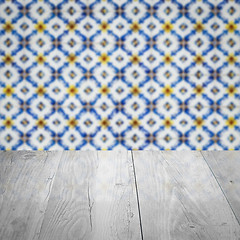 Image showing Wood table top and blur vintage ceramic tile pattern wall