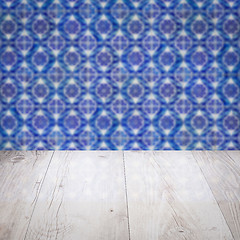 Image showing Wood table top and blur vintage ceramic tile pattern wall