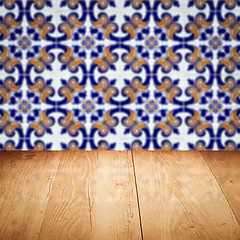 Image showing Wood table top and blur vintage ceramic tile pattern wall