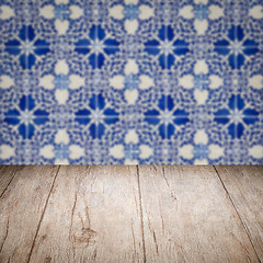 Image showing Wood table top and blur vintage ceramic tile pattern wall