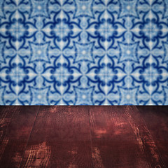 Image showing Wood table top and blur vintage ceramic tile pattern wall