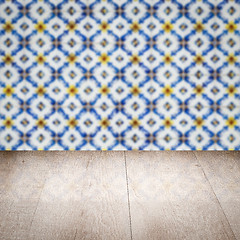 Image showing Wood table top and blur vintage ceramic tile pattern wall