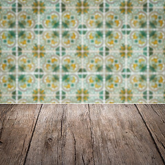 Image showing Wood table top and blur vintage ceramic tile pattern wall