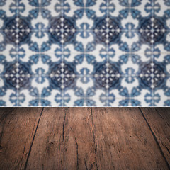 Image showing Wood table top and blur vintage ceramic tile pattern wall