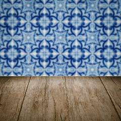 Image showing Wood table top and blur vintage ceramic tile pattern wall