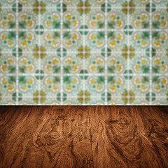 Image showing Wood table top and blur vintage ceramic tile pattern wall