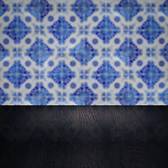 Image showing Wood table top and blur vintage ceramic tile pattern wall