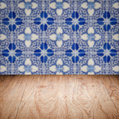 Image showing Wood table top and blur vintage ceramic tile pattern wall