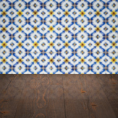 Image showing Wood table top and blur vintage ceramic tile pattern wall