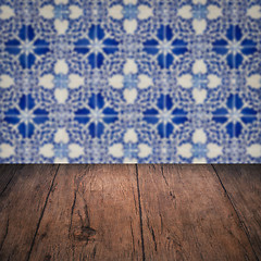 Image showing Wood table top and blur vintage ceramic tile pattern wall