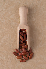 Image showing Wooden scoop with red beans