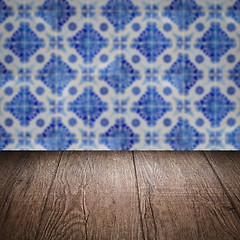 Image showing Wood table top and blur vintage ceramic tile pattern wall