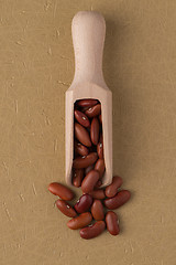 Image showing Wooden scoop with red beans