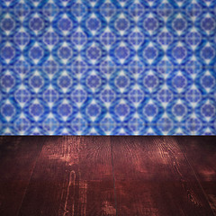 Image showing Wood table top and blur vintage ceramic tile pattern wall