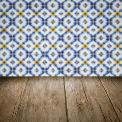 Image showing Wood table top and blur vintage ceramic tile pattern wall