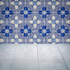 Image showing Wood table top and blur vintage ceramic tile pattern wall