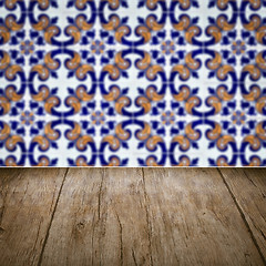 Image showing Wood table top and blur vintage ceramic tile pattern wall