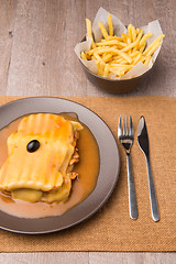 Image showing Francesinha and french fries