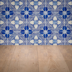 Image showing Wood table top and blur vintage ceramic tile pattern wall