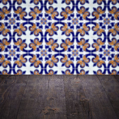 Image showing Wood table top and blur vintage ceramic tile pattern wall