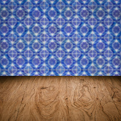 Image showing Wood table top and blur vintage ceramic tile pattern wall