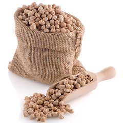 Image showing Uncooked chickpeas and wooden scoop