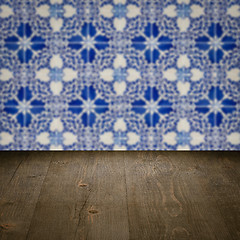 Image showing Wood table top and blur vintage ceramic tile pattern wall