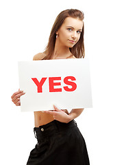 Image showing lovely girl holding yes board