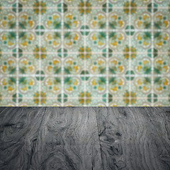 Image showing Wood table top and blur vintage ceramic tile pattern wall