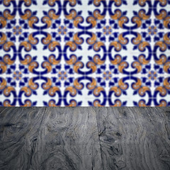 Image showing Wood table top and blur vintage ceramic tile pattern wall