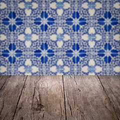 Image showing Wood table top and blur vintage ceramic tile pattern wall