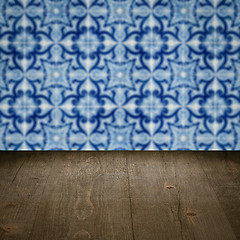 Image showing Wood table top and blur vintage ceramic tile pattern wall