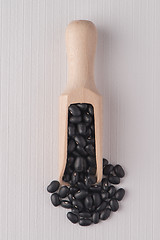 Image showing Wooden scoop with red beans