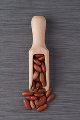 Image showing Wooden scoop with red beans