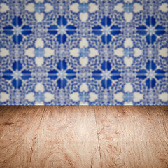 Image showing Wood table top and blur vintage ceramic tile pattern wall