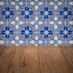 Image showing Wood table top and blur vintage ceramic tile pattern wall