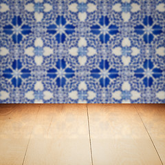 Image showing Wood table top and blur vintage ceramic tile pattern wall