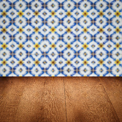 Image showing Wood table top and blur vintage ceramic tile pattern wall