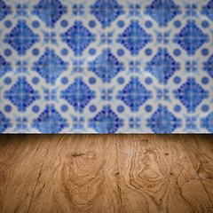 Image showing Wood table top and blur vintage ceramic tile pattern wall