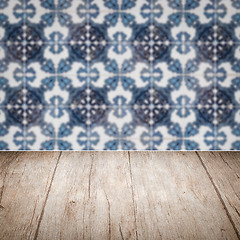 Image showing Wood table top and blur vintage ceramic tile pattern wall