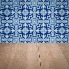 Image showing Wood table top and blur vintage ceramic tile pattern wall