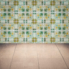 Image showing Wood table top and blur vintage ceramic tile pattern wall