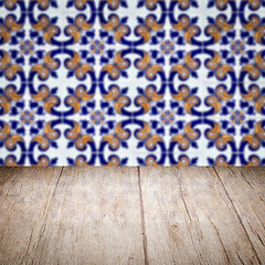 Image showing Wood table top and blur vintage ceramic tile pattern wall