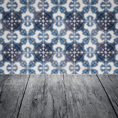 Image showing Wood table top and blur vintage ceramic tile pattern wall