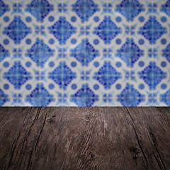 Image showing Wood table top and blur vintage ceramic tile pattern wall